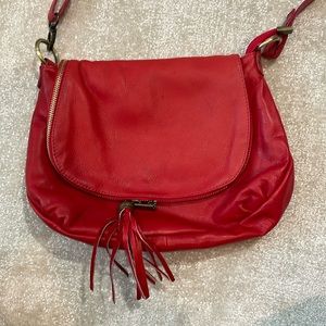 Red Italian leather side bag with zipper and button